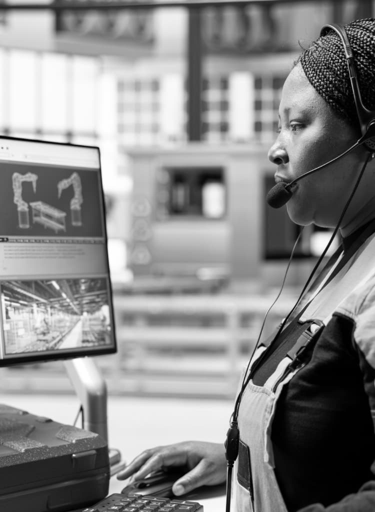 Customer support specialist with headset at workstation