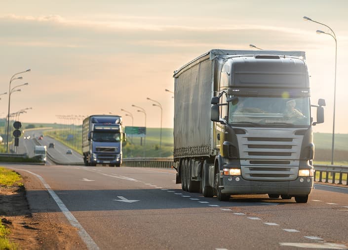 Haulage truck convoy on highway